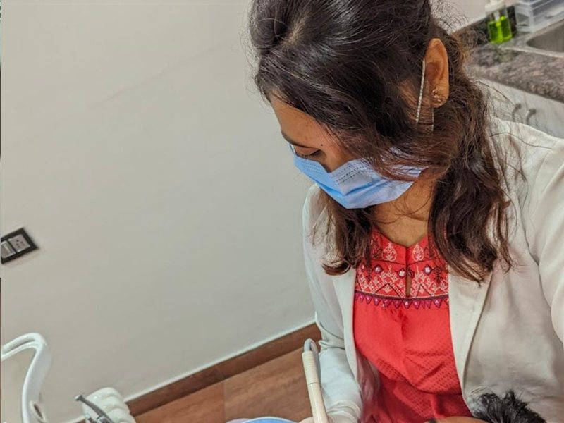 Dr. Meghana with Patient at The Tooth Stop dental clinic